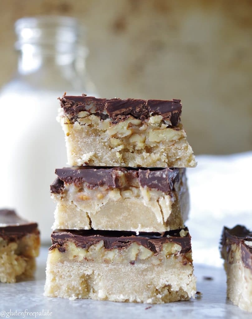 Three gluten-free turtle bars stacked on top of one another