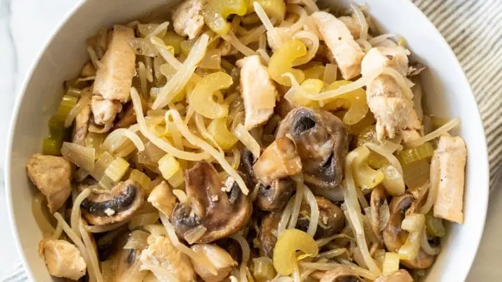 a close up of chicken subgum chow mein in a white bowl