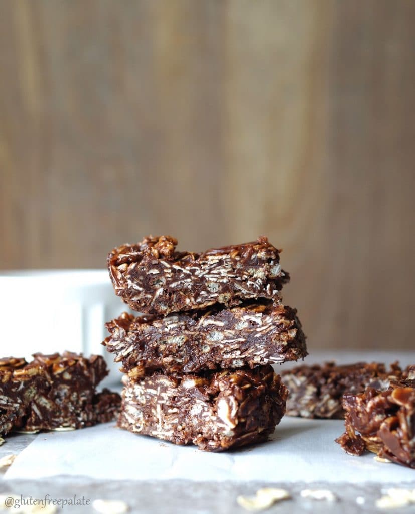 three chocolate coconut oat bars stacked