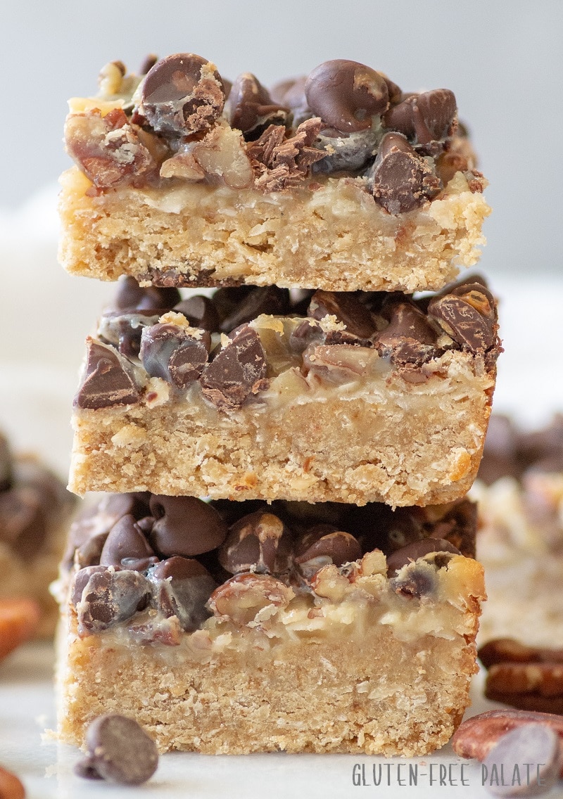 a close up view of three seven layer bars stacked