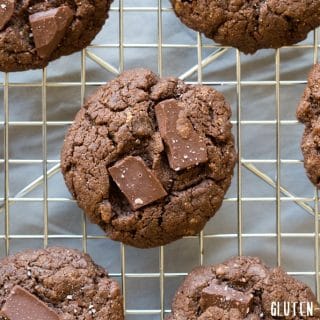 top view of brown sunbutter cookies with chocolate chunks on a wire cooling rack