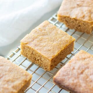 paleo pumpkin bars cut in squares on a wire rack