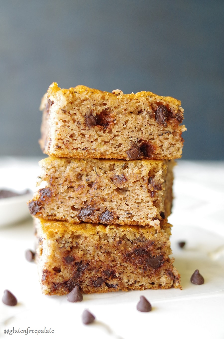 three Grain-Free Banana Everything Bars stacked on a white counter