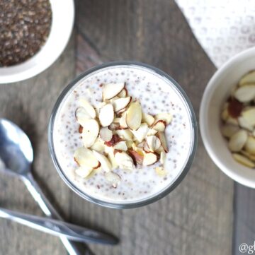 top down view of overnight paleo porridge in a class bowl with sliced almonds.