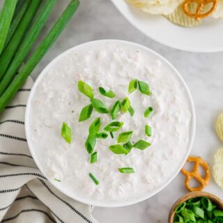 top down photo of gluten-free seafood dip topped with sliced green onions