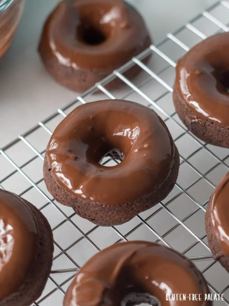 Gluten-Free Vegan Donuts with a chocolate glaze on a wire cooling rack