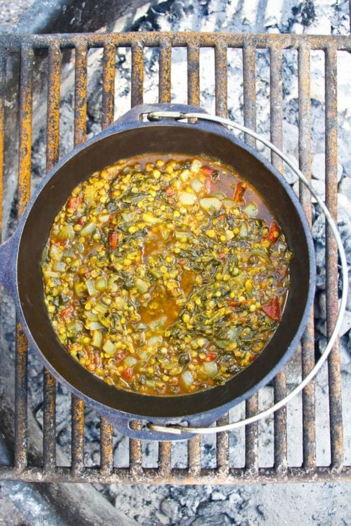 a cast iron pot filled with lentils