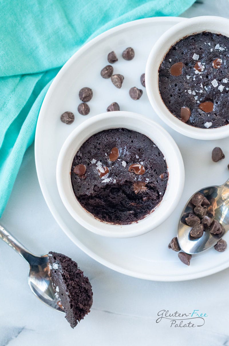 top down view of a vegan mug brownie in a ramekin with a bite out