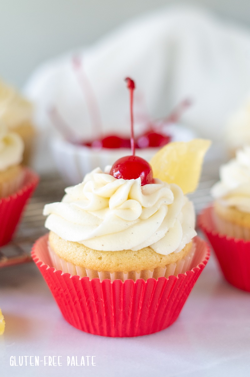 Gluten Free Pina Colada Cupcakes with a cherry on top
