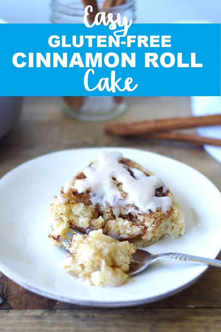 a pinterest pin with a photo of a side view of a slice of cinnamon roll cake on a white plate with a fork with the words easy gluten free cinnamon roll cake