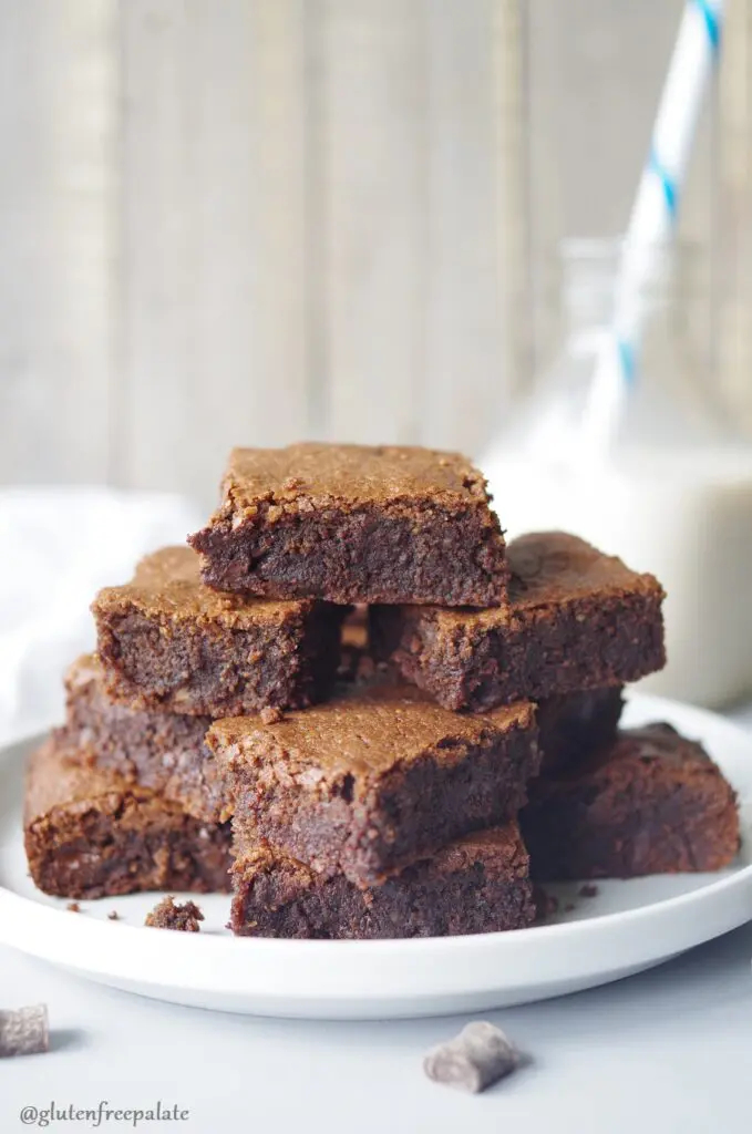 Grain-Free Hazelnut Brownies stacked on a white plate