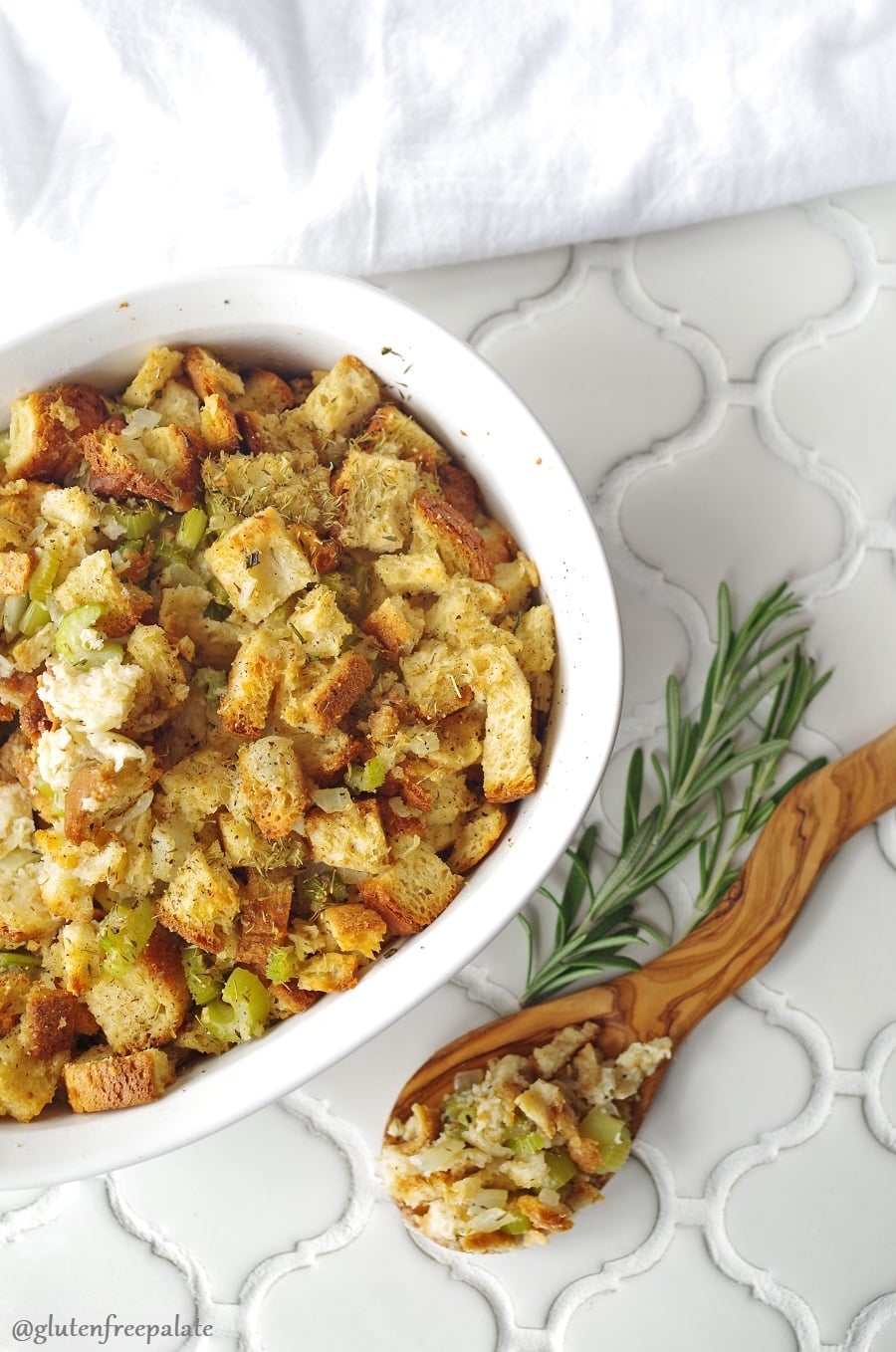 a serving bowl Gluten-Free stuffing on a white counter