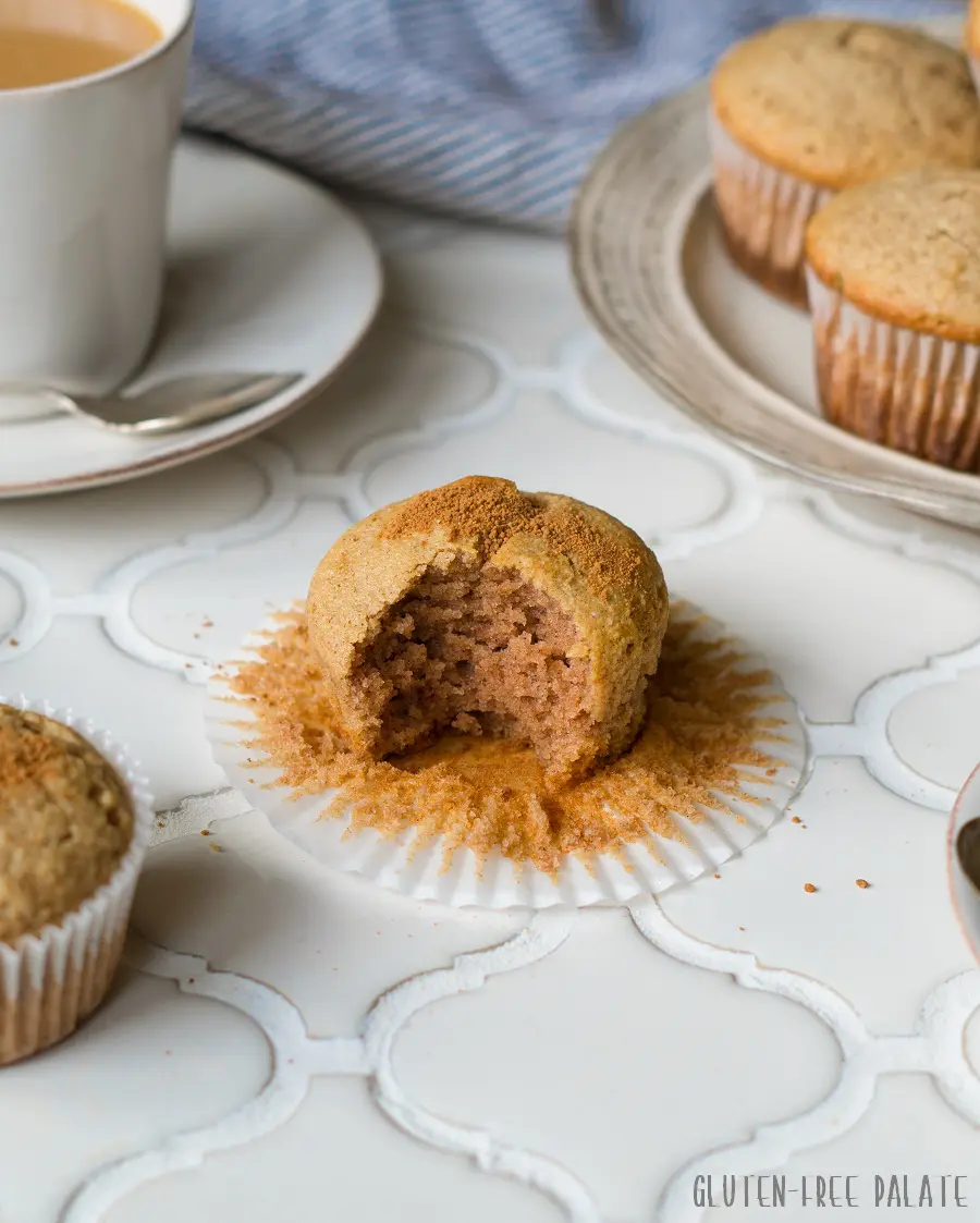 a close up of a paleo snickerdoodle muffin on a white counter