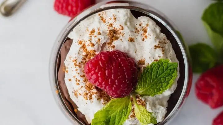 top view of a Gluten-Free Vegan Mexican Chocolate Pudding topped with mint and raspberry