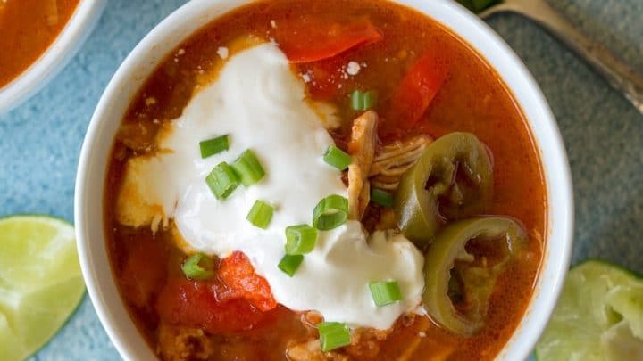 top view of Paleo Instant Pot Chicken Fajita Soup topped with sourcream