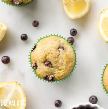 top down view of paleo blueberry muffins next to lemon wedges