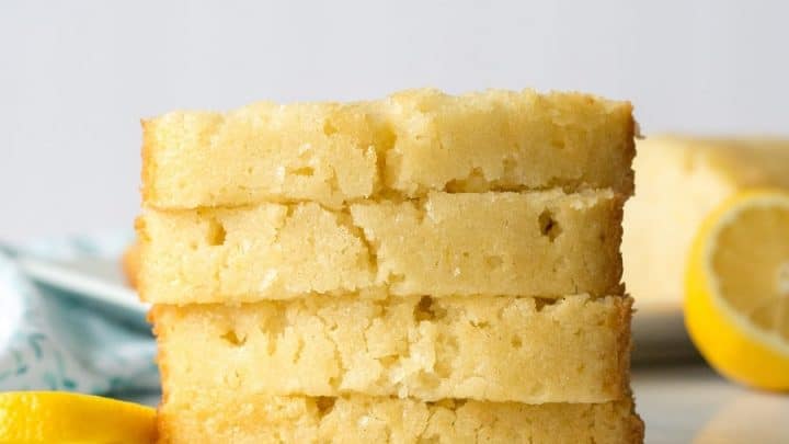 four stacked pieces of Gluten-Free Lemon Bread on marble
