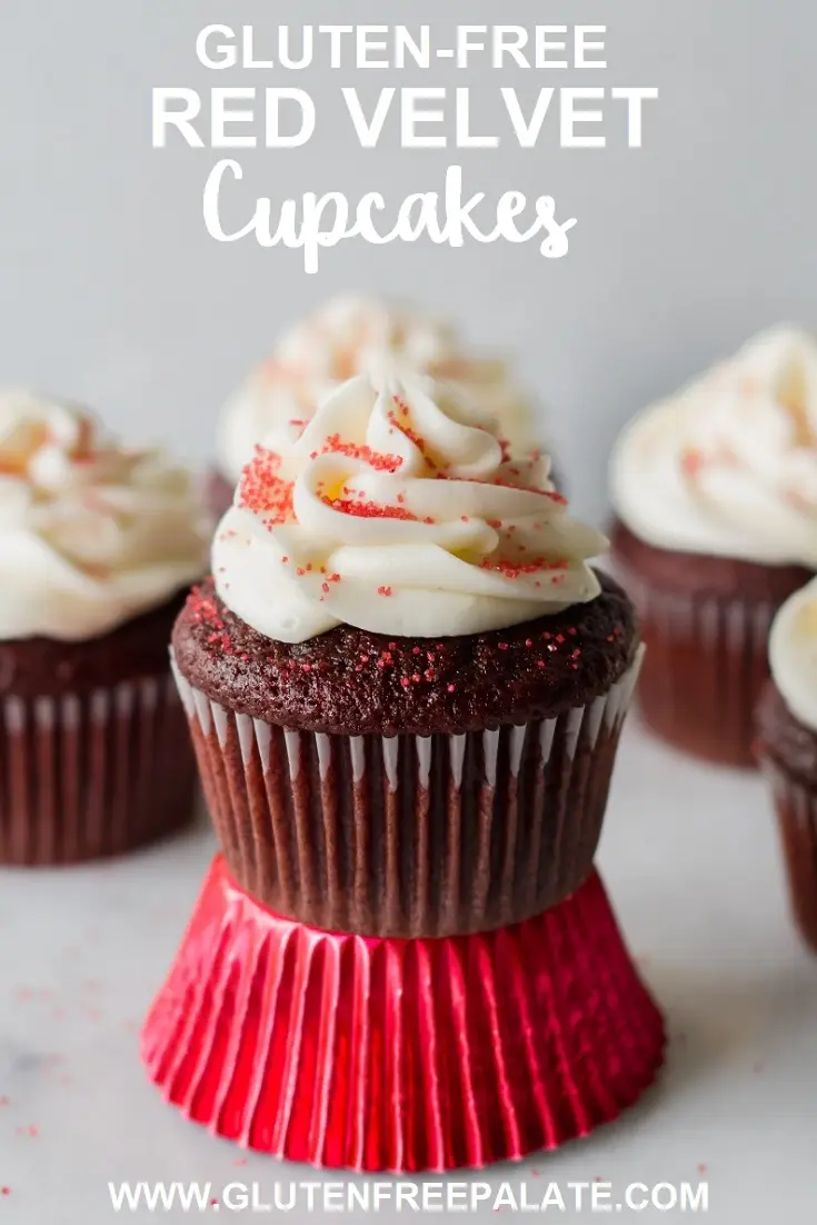 a pinterest pin of a red velvet cupcake topped with white frosting and red sugar, sitting on a shiny red paper liner