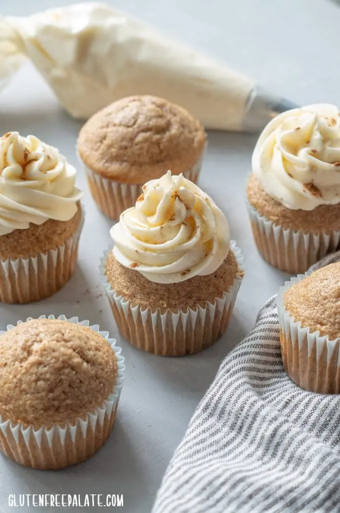 frosted Gluten-Free Chai Cupcakes on a striped grey napkin