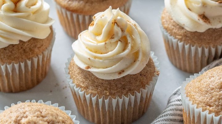 frosted Gluten-Free Chai Cupcakes on a striped grey napkin