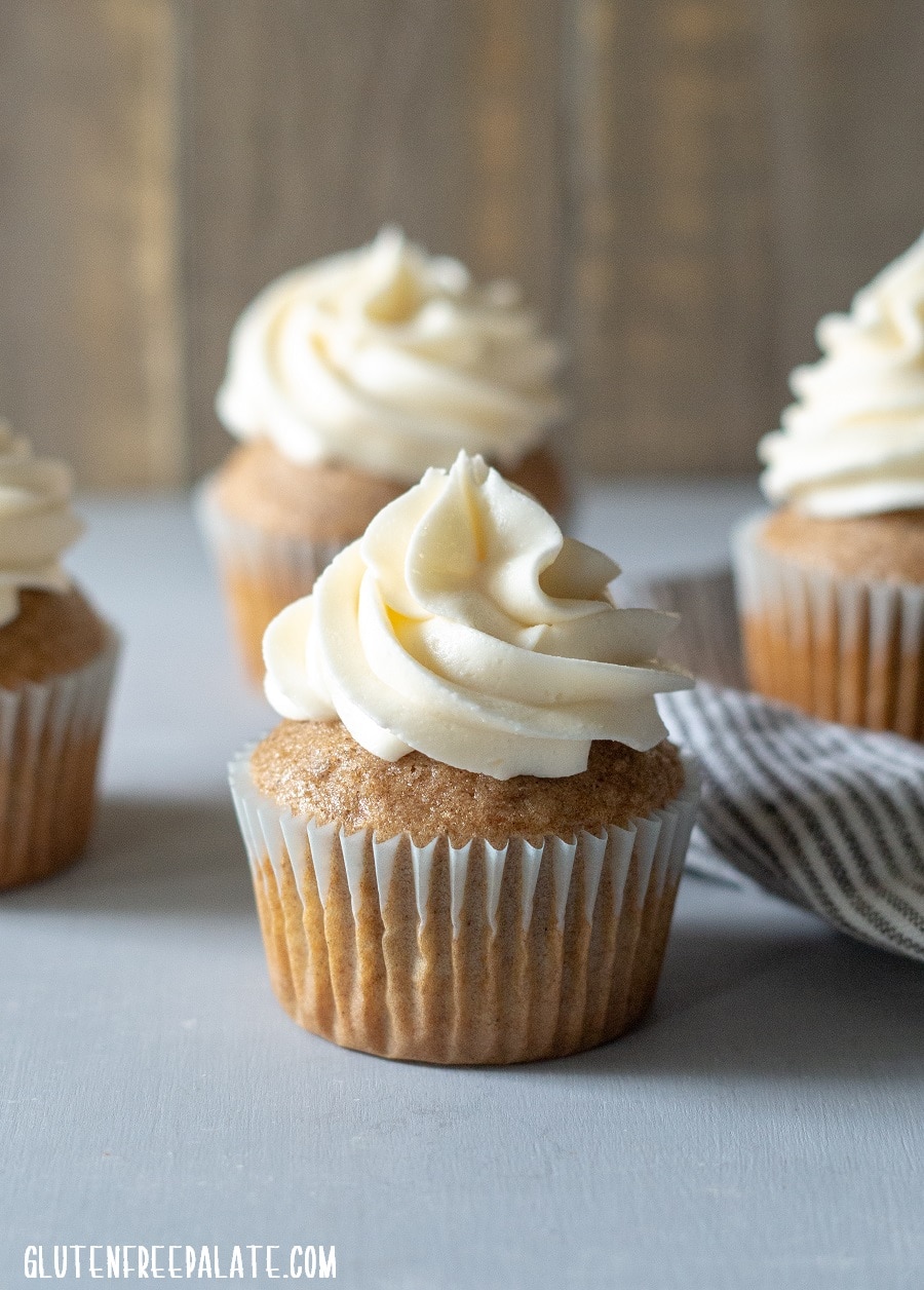 a close up of a chai cupcake with white frosting piped on top