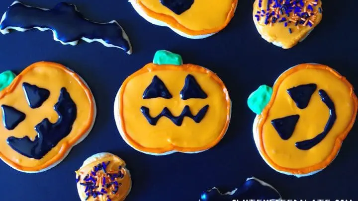 A close up of gluten free sugar cookies decorated like jack-o-lanterns