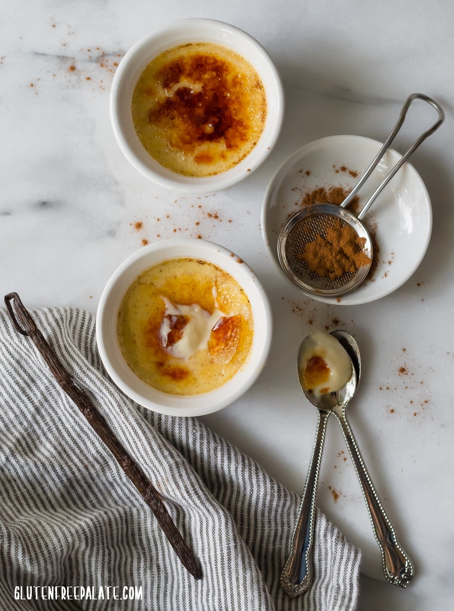 a top down view of Chai Creme Brulee in a white ramekin with a spoon taking a bite out