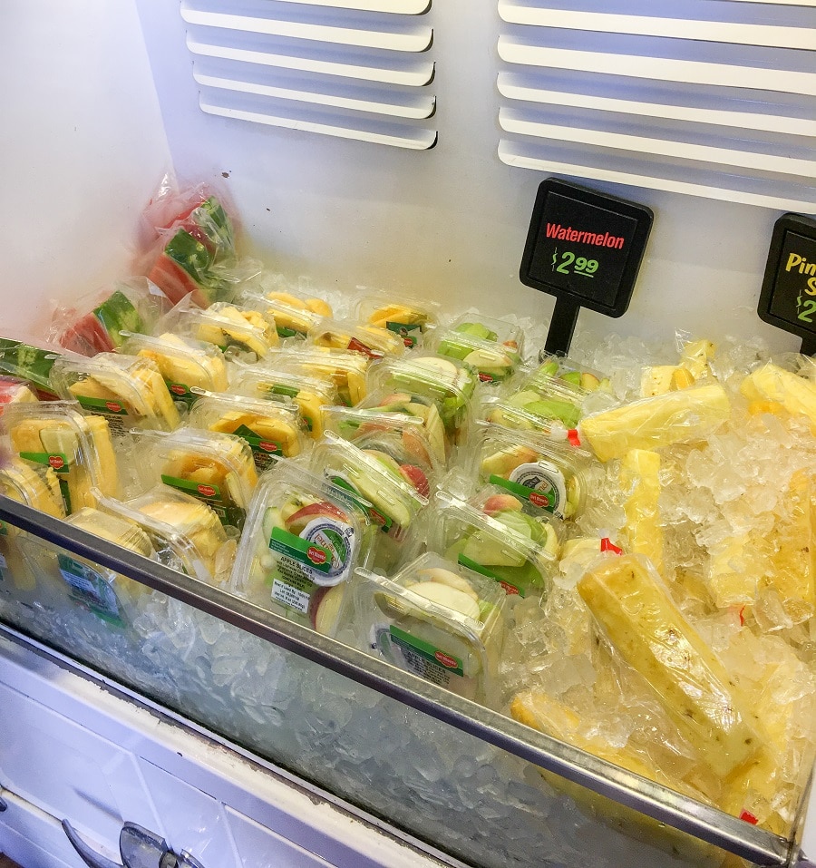 a open cooler of packaged fruit for sale at disneyland
