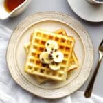top view of Gluten-Free Waffles topped with bananas and mini chocolate chips