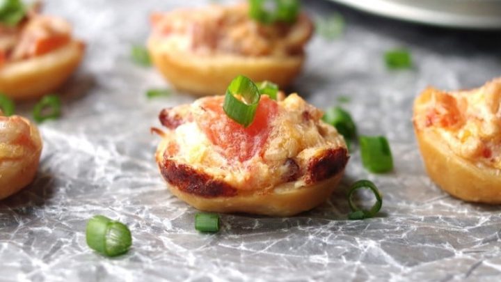 close up of a gluten free bacon tomato cup topped with scallions