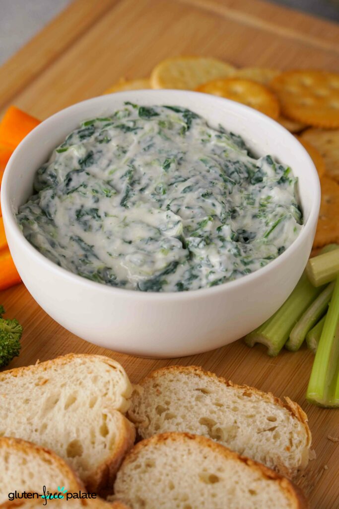 Spinach dip in a white bowl.