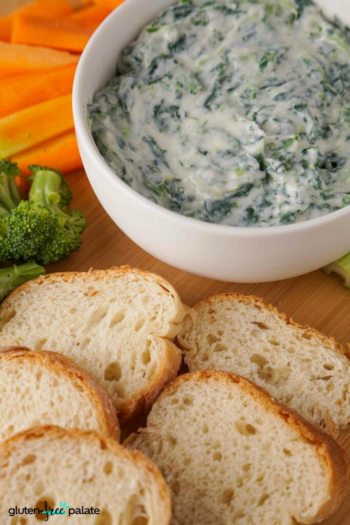 The best spinach dip, served with bread and fresh veggies.