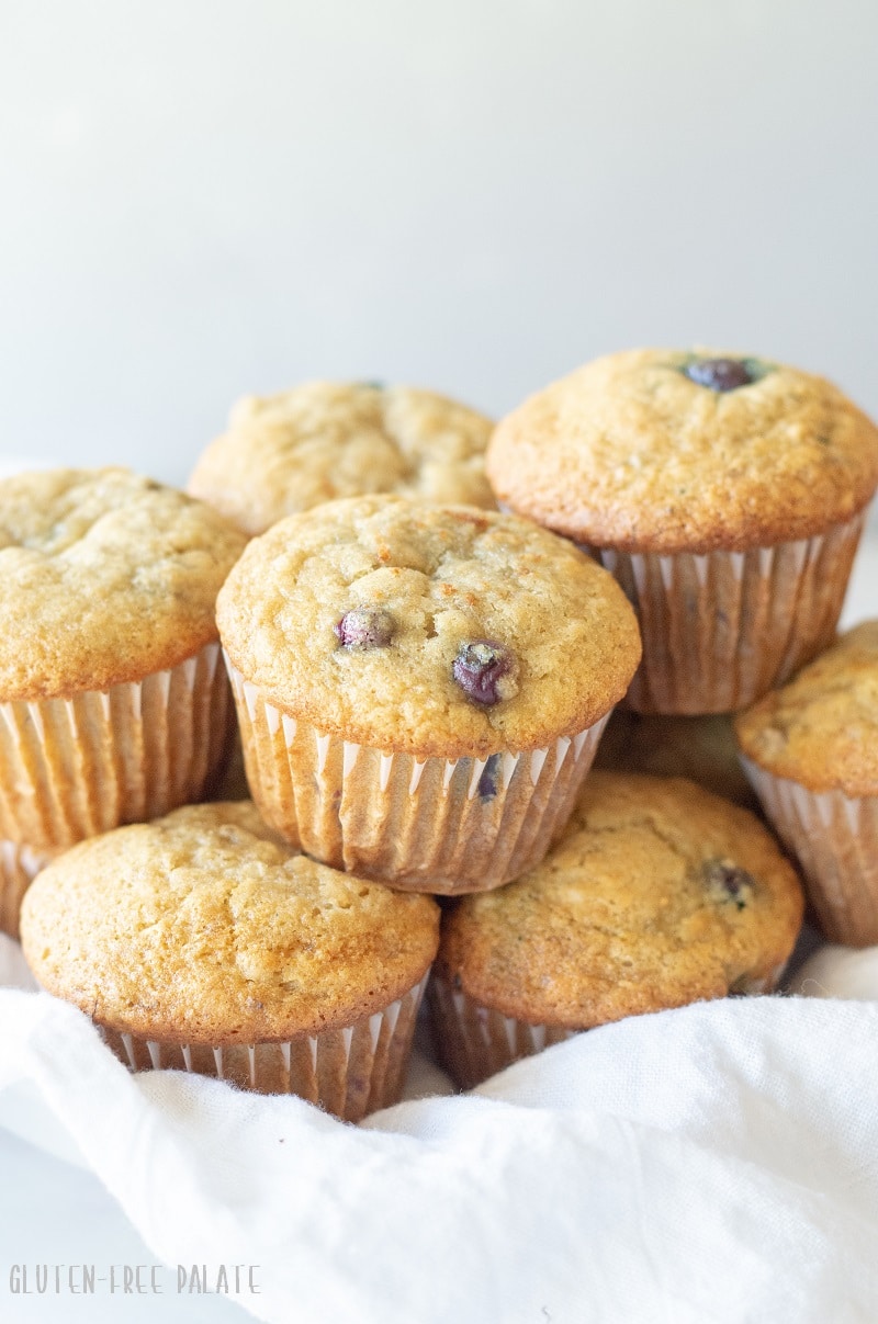 Gluten-Free blueberry banana muffins in a bowl with a white napkin