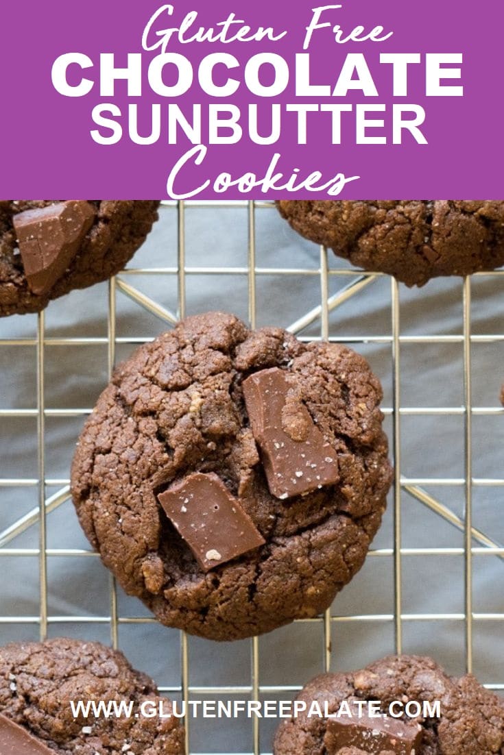 roundsunbutter cookies with chocolate chunks on a wire rack with the words gluten free chocolate sunbuter cookeis written at the top