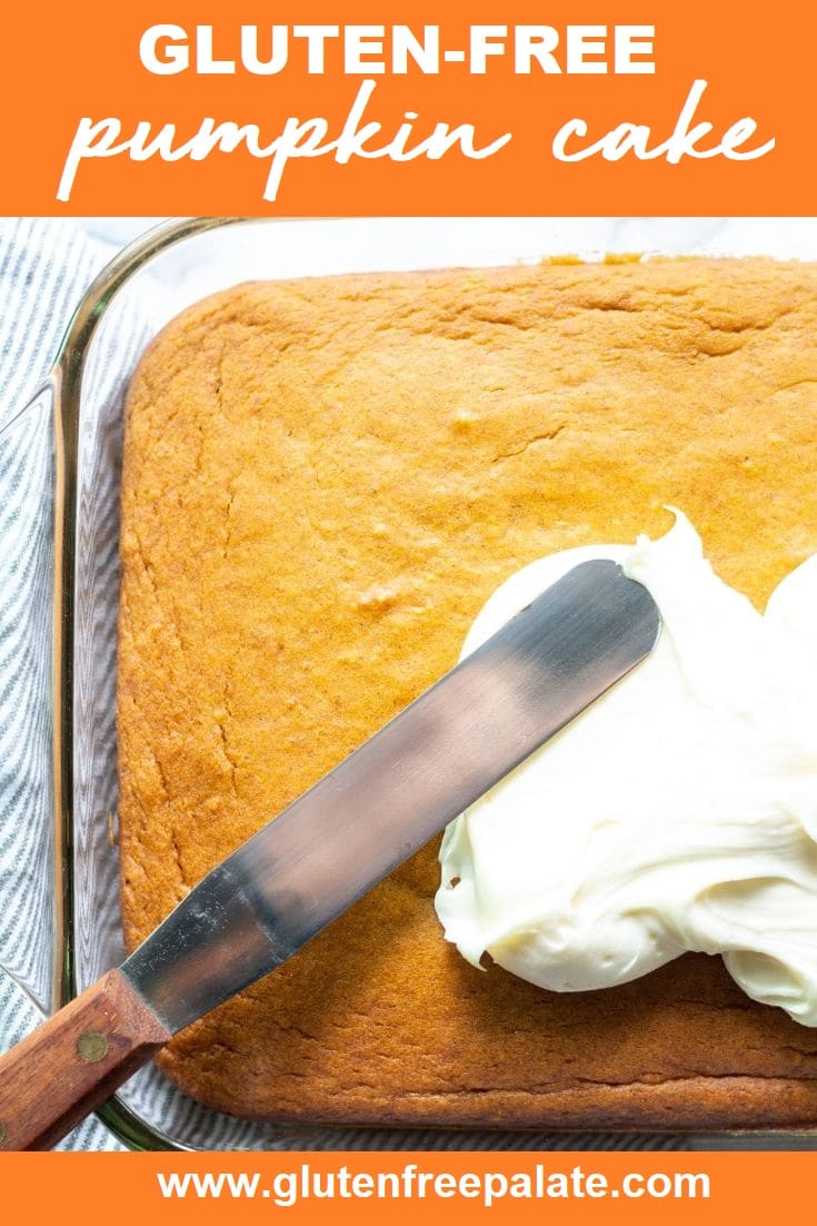 a knife spreading white frosting on gluten free pumpkin cake in a glass baking pan with the words gluten free pumpkin cake a the top