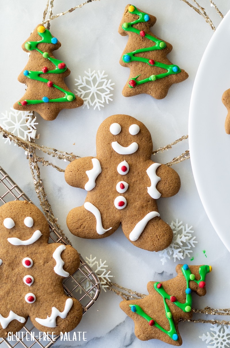 gluten-free gingerbread men and tree cookies with white and green icing.