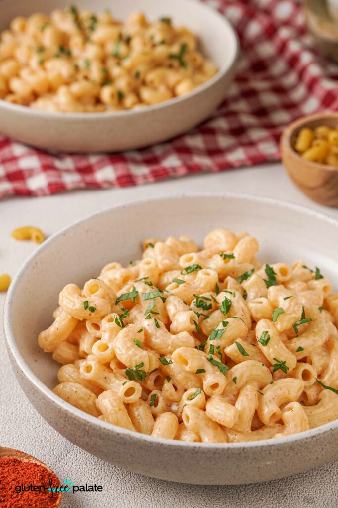 Gluten-free mac and cheese in a bowl with garnish.