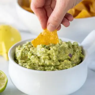 chip dipping into guacamole
