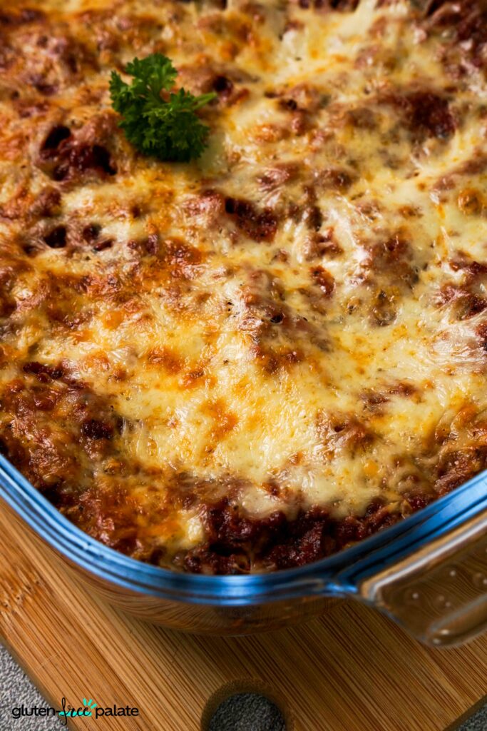 Zoomed in view of Gluten-Free lasanga in a glass casserole dish.