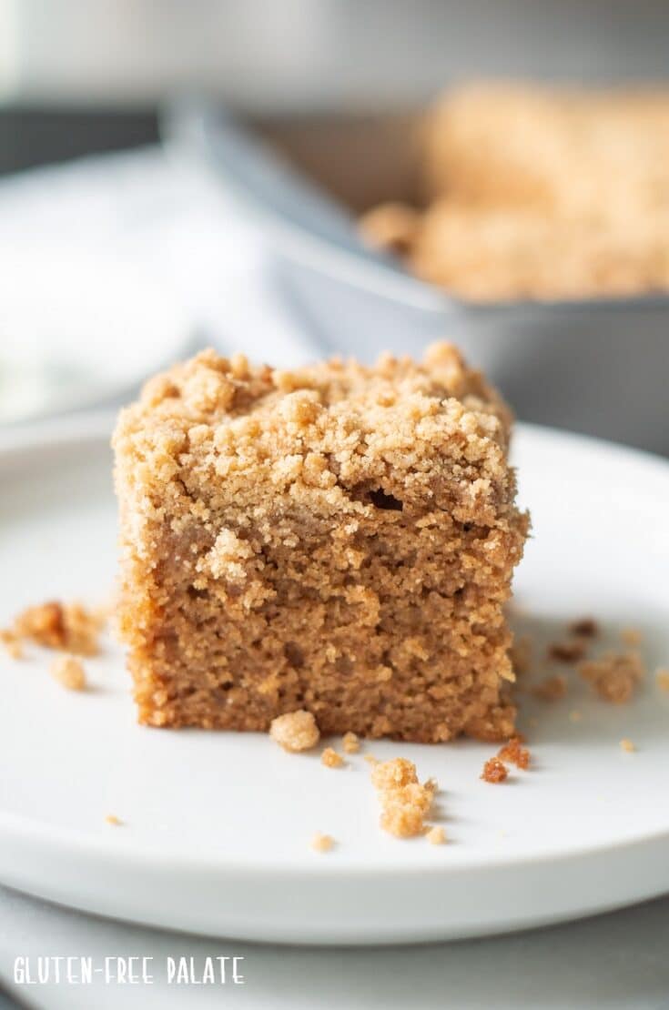 a slice of gluten free coffee cake on a white plate