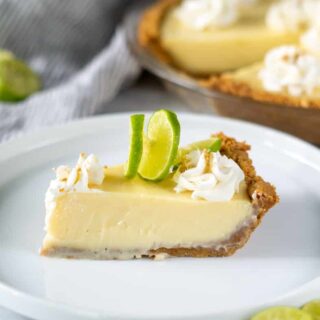 a slice of gluten free key lime pie on a white plate