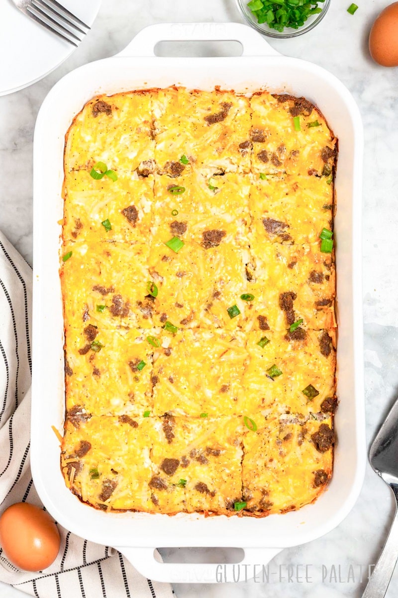 a top-down view of a gluten-free breakfast casserole in a white baking dish