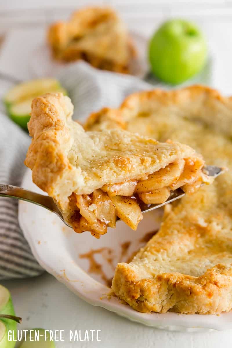 a serving utensil with a slice of gluten free apple pie