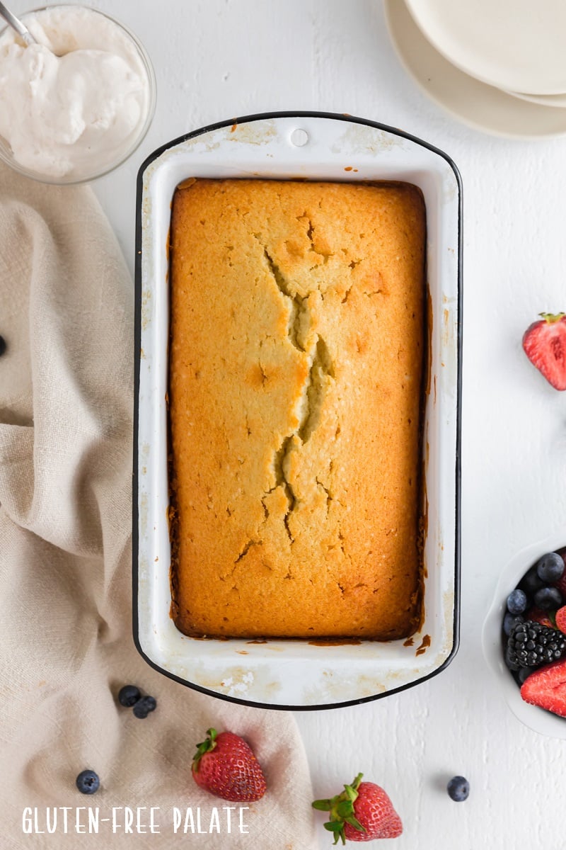 top down view of gluten free pound cake in a white baking pan
