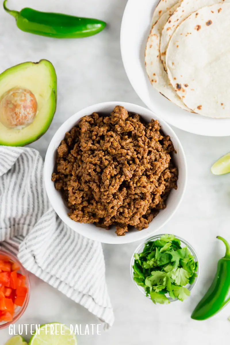 top down view of gluten-free taco meat in a white bowl