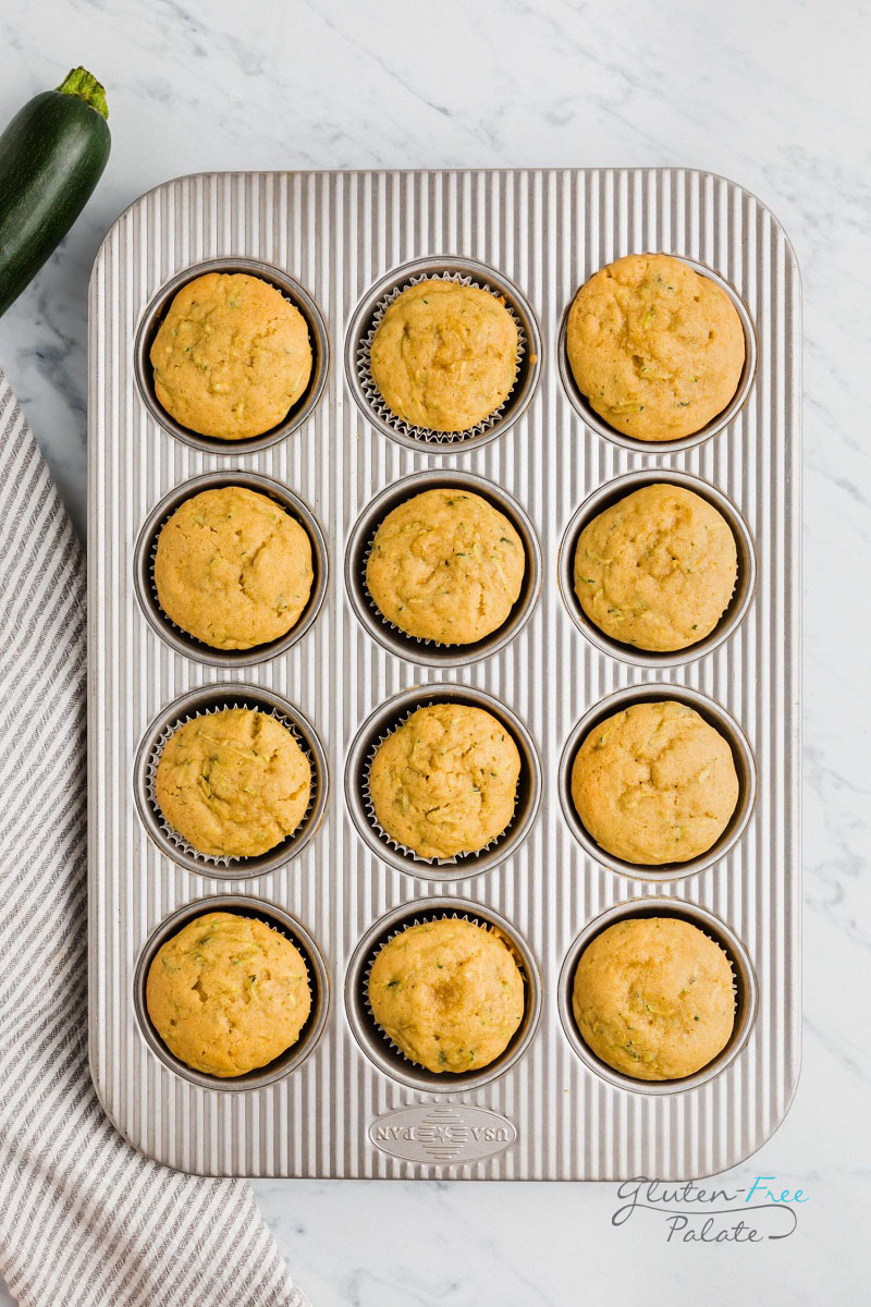 top down view of gluten free zucchini muffins in a muffin baking pan