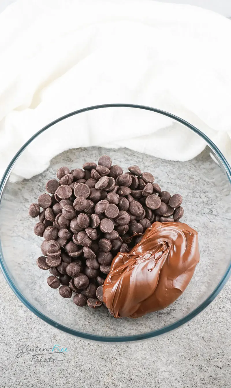 chocolate chips and nutella in a clear glass bowl