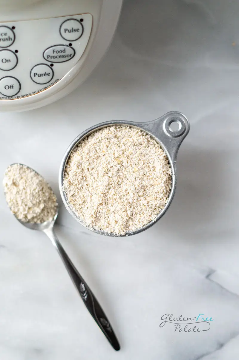 a measuring cup with oat flour