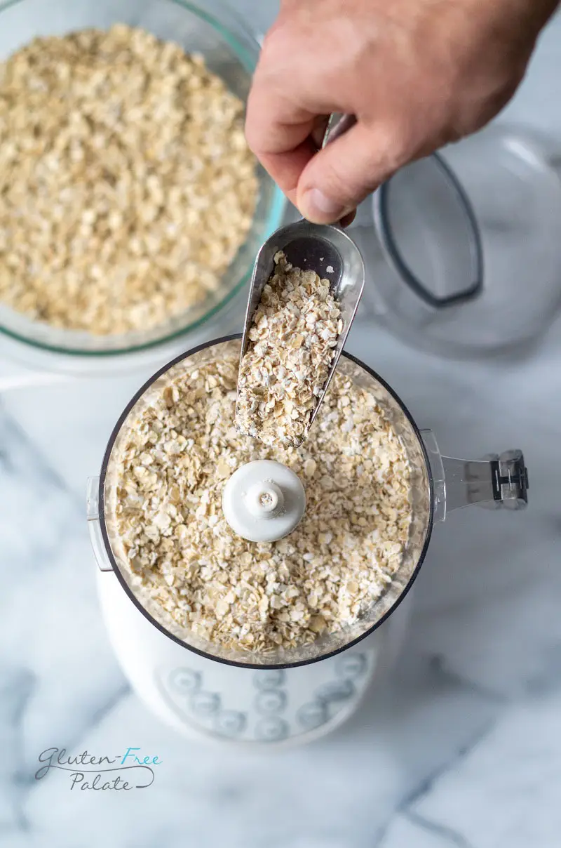 a food processor filled with oats