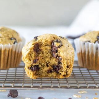 oat flour muffins with one with a bite out showing the texture